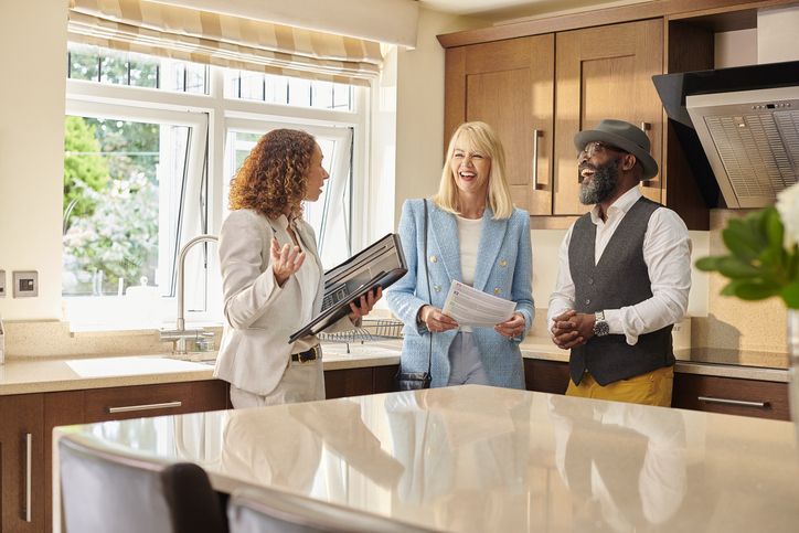 Woman real estate agent showing a house